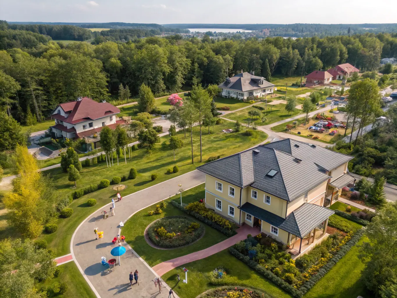Aerial photograph of a meticulously planned residential area, showcasing efficient land use and harmonious integration with the natural environment, representing 22 Architects' site planning expertise.
